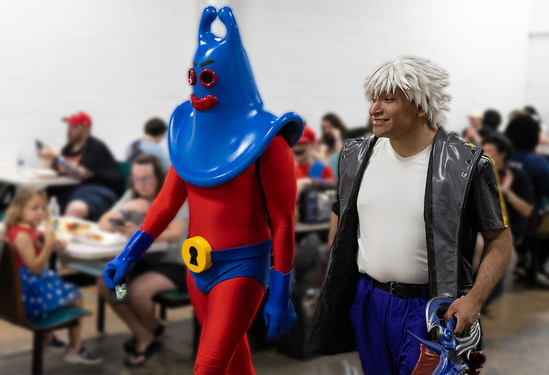 Cosplay participants posing in elaborate costumes at TooManyGames.