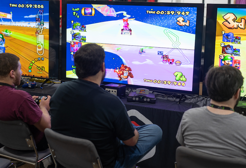 Gamers competing in a tournament at TooManyGames.